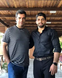 صمیمیت خاص منوچهر هادی با قهرمان المپیک/ عکس